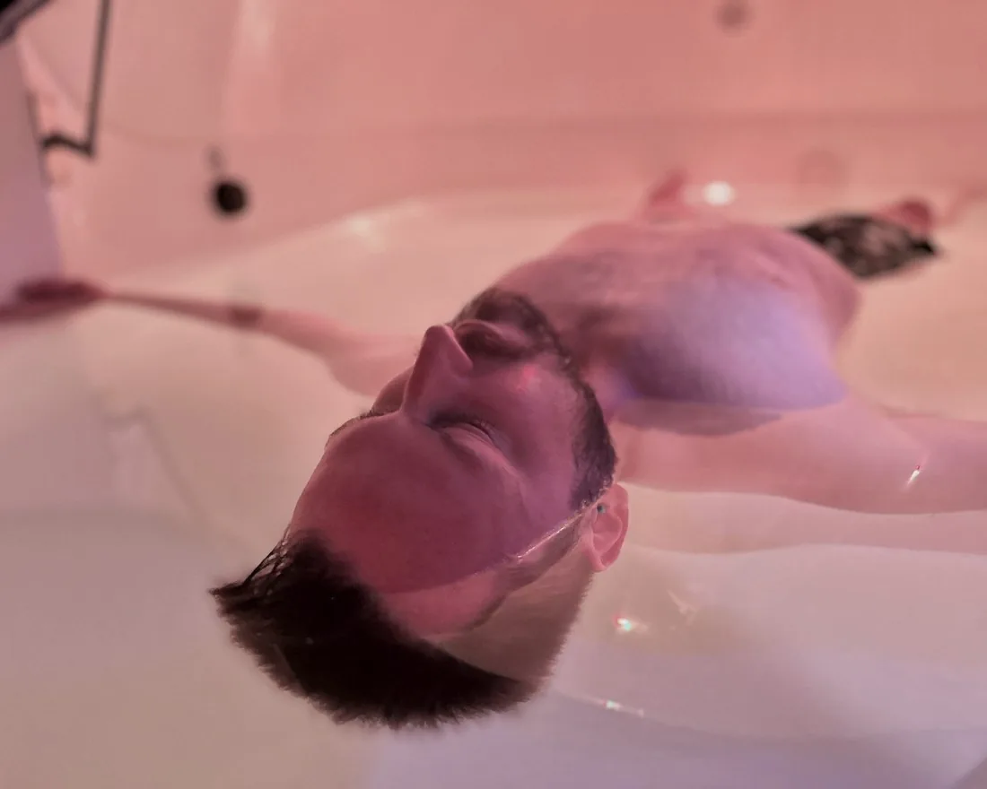 Floating effortlessly in a sensory deprivation float pod at Float Therapy Wilmslow